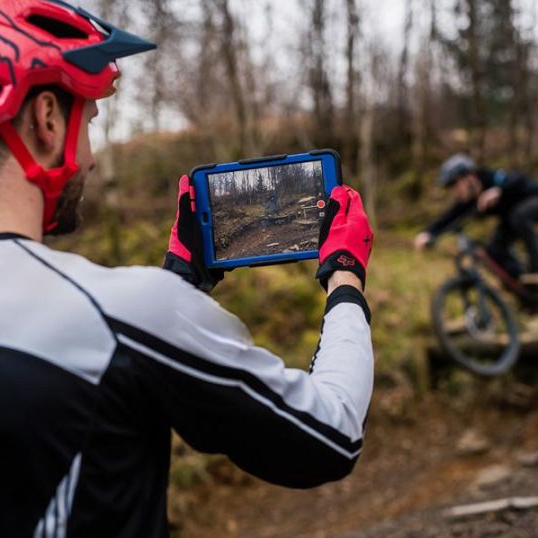 MTB coach recording student for feedback