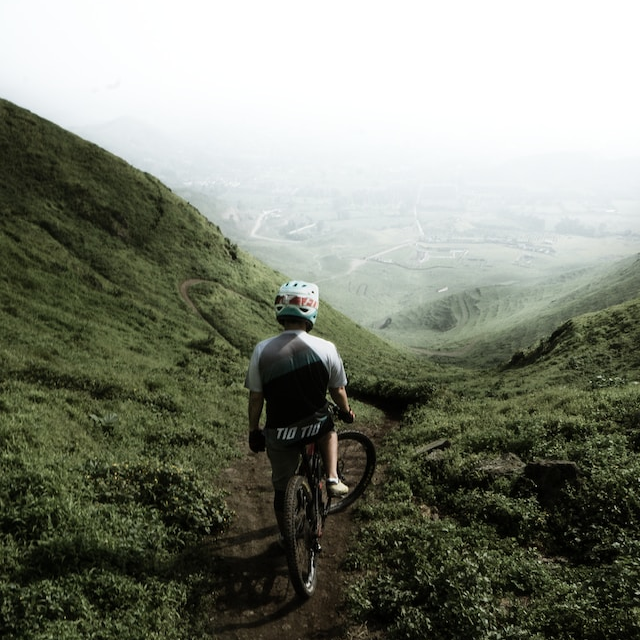 Lone rider looking out across a huge valley